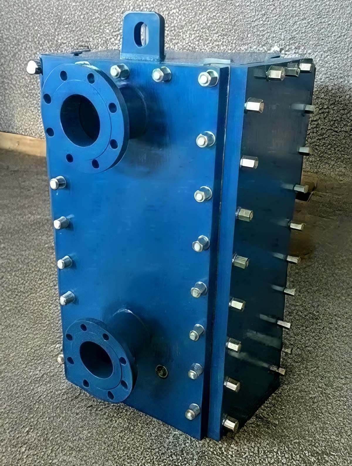 Side panels bolted on. Removing them opens both sides of the block for mechanical cleaning.